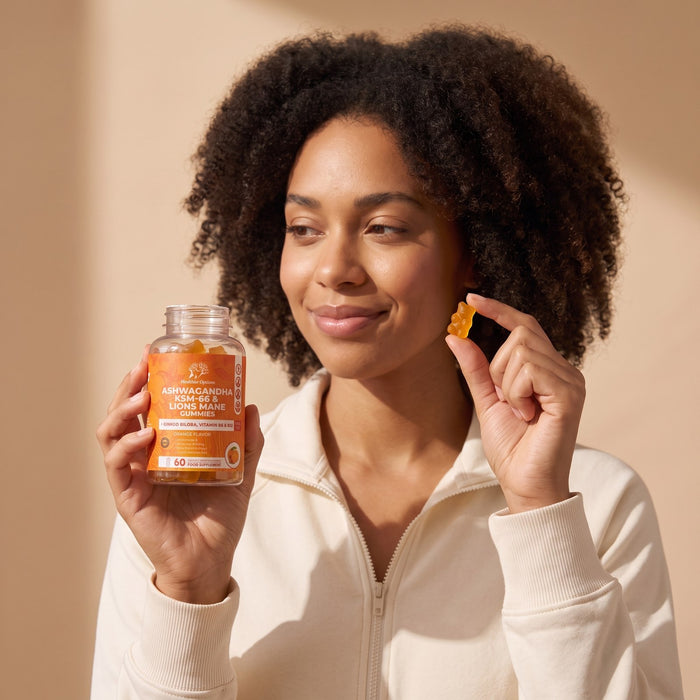 Woman holding an Ashwagandha gummy and the Healthier Options bottle