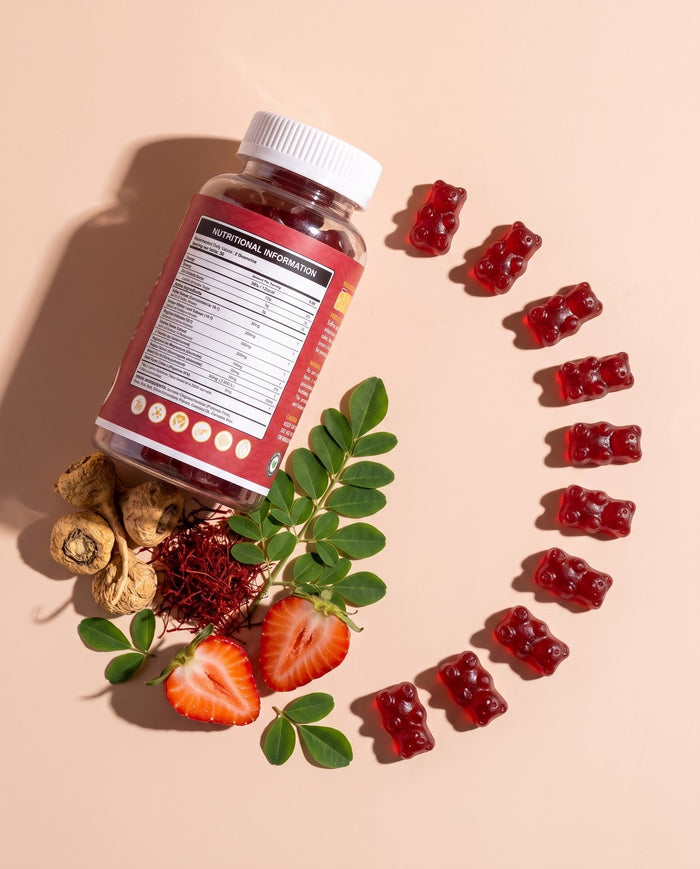 Healthier Options gummies arranged in a ring with maca root, saffron threads and strawberries