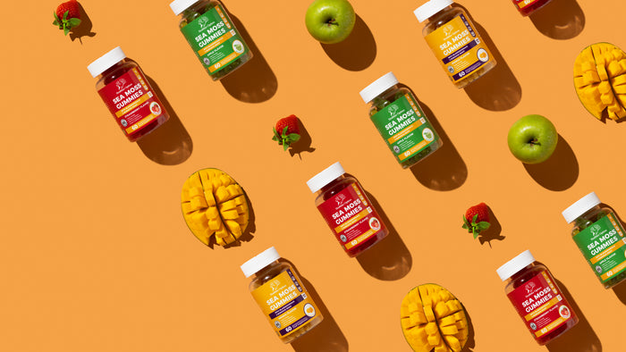 Sea Moss Gummies flat lay with mango, apple and strawberry